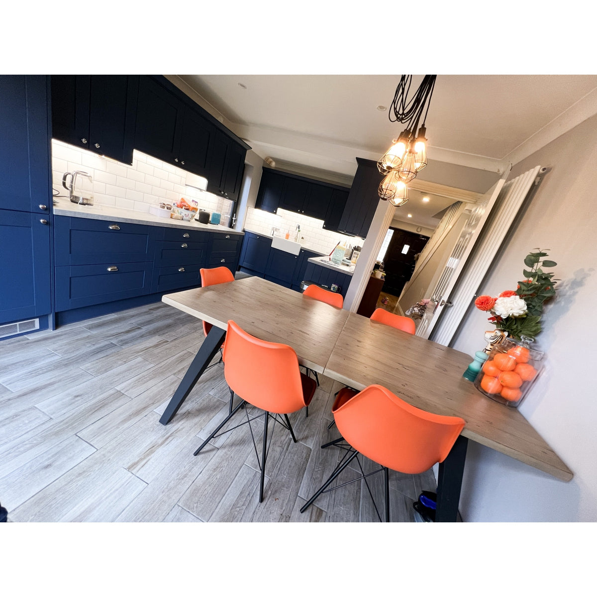 Soho Orange Plastic Dining Chair with Black Metal Legs